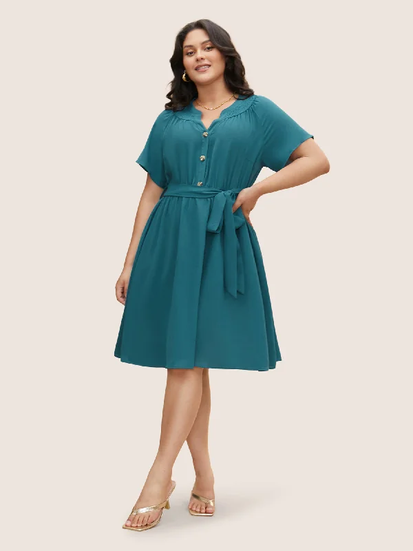 Plus size dresses for casual Fridays stay relaxed -Plus size dresses with bold colors for a statement look -Shirred Notched Button Up Belted Dress