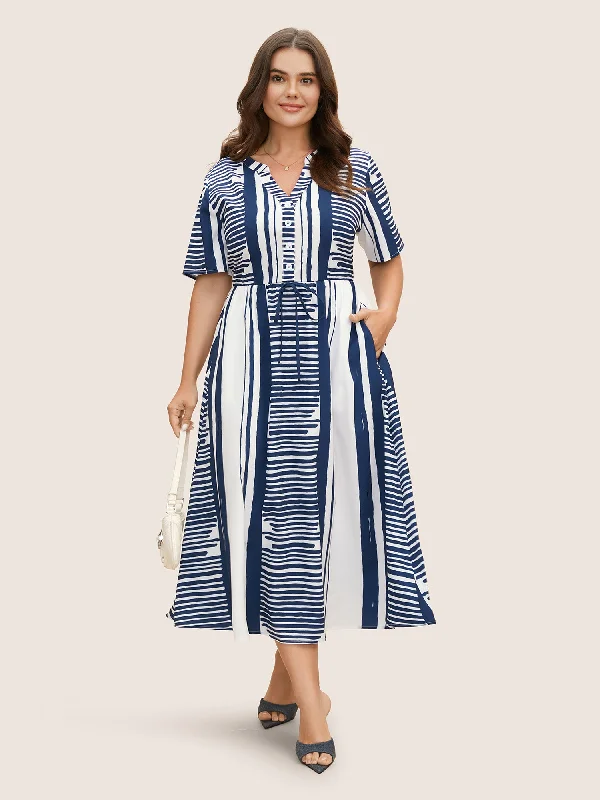 Plus size dresses for cold seasons warm up -Plus size dresses with bold patterns for a fun look -Notched Collar Striped Patchwork Drawstring Dress