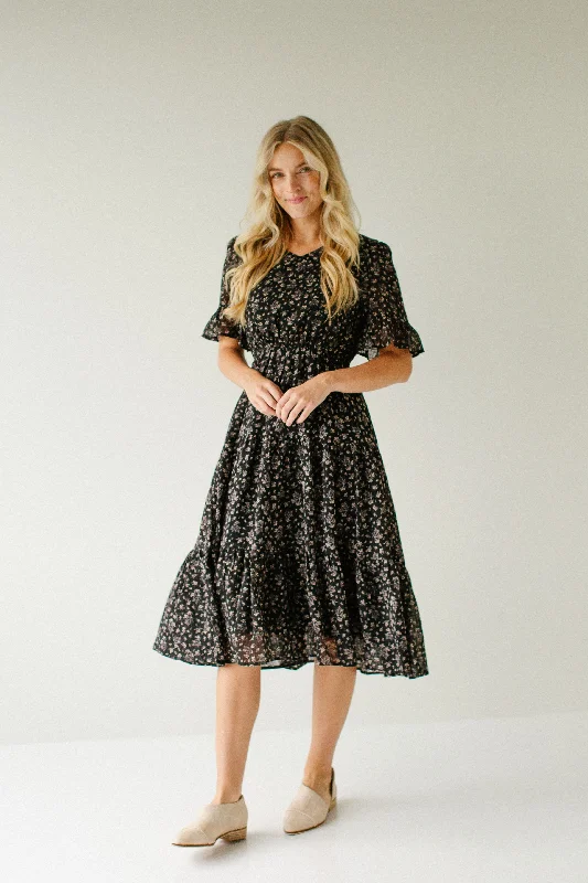 Plus size dresses with unique cuts stand apart -Plus size dresses with a flowing skirt for ease of movement -'Mary' Ditsy Floral Textured Midi Dress in Black