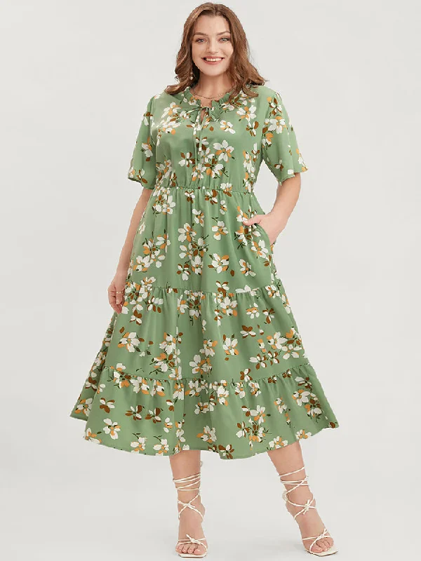 Plus size dresses with unique cuts stand apart -Plus size dresses with high-low hems for variety -Floral Print Frill Trim Tie Neck Pocket Ruffle Tiered Dress