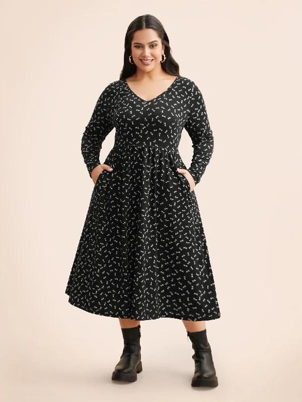 Plus size dresses with bold cuts make statements -Plus size dresses with satin for a sophisticated look -V Neck Dragonfly Pattern Midi Dress